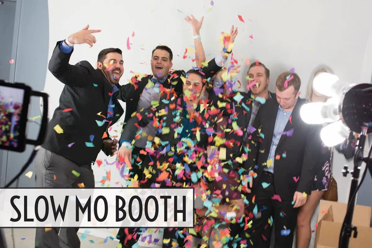 Guests celebrating with colorful confetti in the Slow Mo Booth