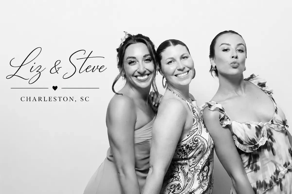 Three wedding guests posing for a black-and-white Glam Booth portrait