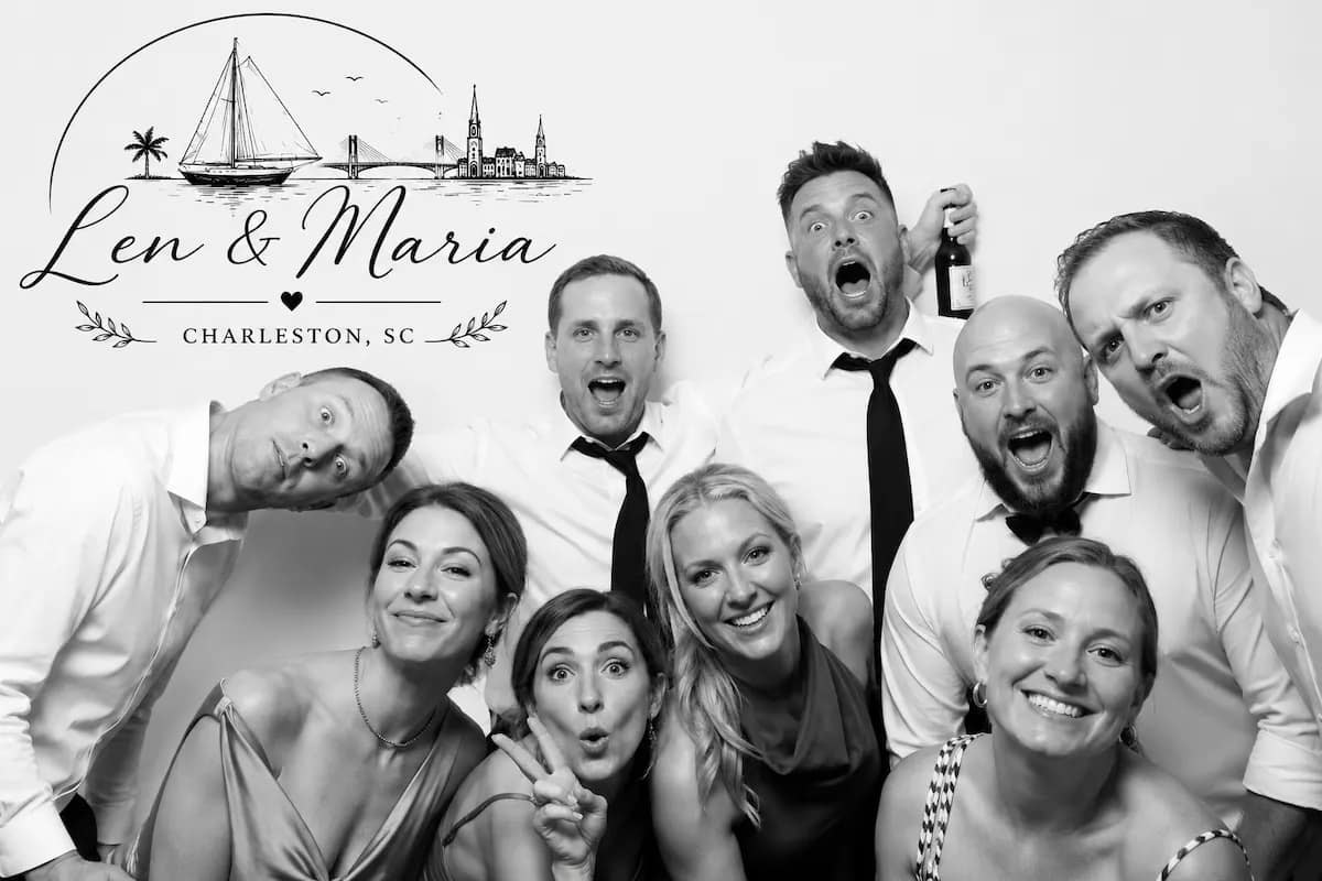 Wedding party laughing together in a black-and-white Glam Booth portrait