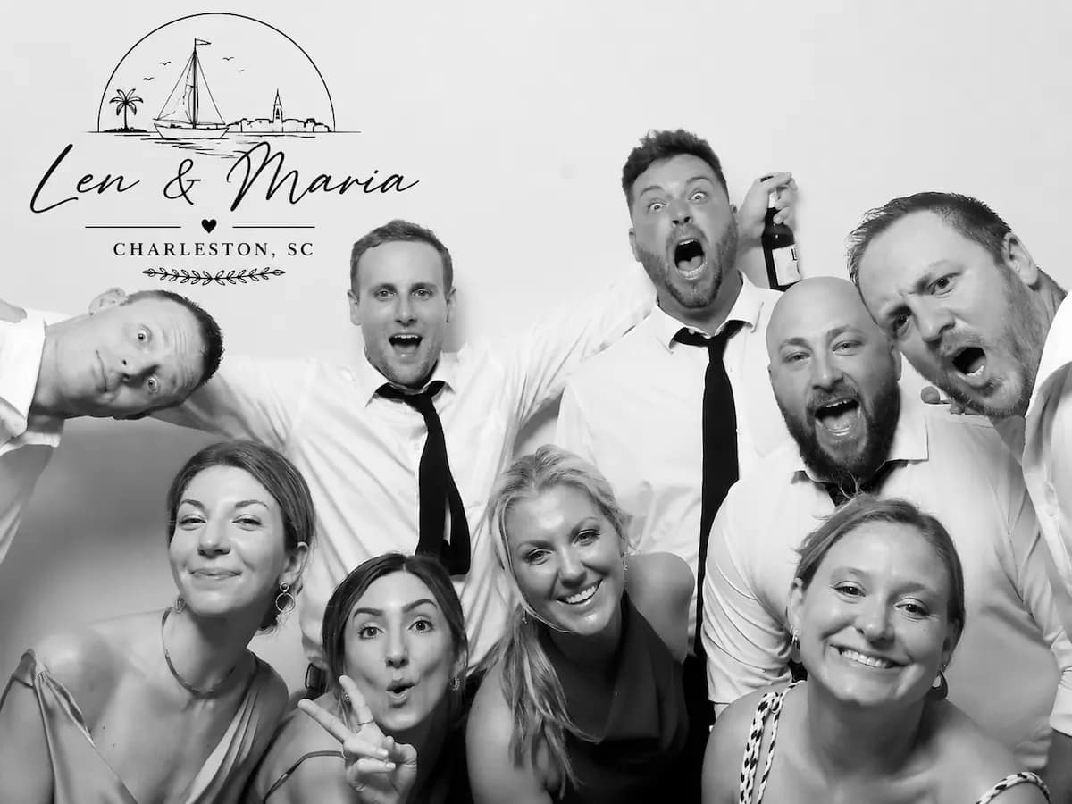 Wedding guests making playful expressions in a black-and-white Glam Booth portrait